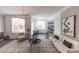 Bright living room featuring modern decor, a comfortable sofa, and plenty of natural light at 630 Skytop Dr # 157, Cumming, GA 30040