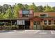 A welcoming brick restaurant with outdoor seating and handicap parking spots in the parking lot at 630 Skytop Dr # 157, Cumming, GA 30040