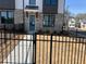 Townhome with brick and white siding, black trim, fenced yard, and tidy landscaping at 621 Silva St # 124, Cumming, GA 30040