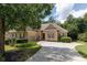 House exterior showcasing a brick facade, landscaping, and a driveway at 186 Thorn Creek Way, Dallas, GA 30157