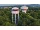 Scenic aerial view of the Cumming water towers surrounded by lush greenery at 635 Skytop Dr, Cumming, GA 30040