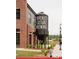 Crooked Culture Brewing has a distinctive silo, brick facade, and landscaped surroundings in a commercial setting at 635 Skytop Dr, Cumming, GA 30040