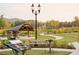 Community outdoor amphitheater with lawn seating, stage, and landscaped surroundings offering a gathering space for events at 635 Skytop Dr, Cumming, GA 30040