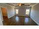 Spacious main bedroom with hardwood floors and a large walk-in closet at 635 Skytop Dr, Cumming, GA 30040