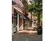 Chico's and Loft retail storefronts with awnings and a street bench on a sunny day at 635 Skytop Dr, Cumming, GA 30040