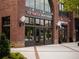 Attractive brick retail building with large windows and decorative lighting; Top Knotch Boutique at 635 Skytop Dr, Cumming, GA 30040