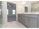 Modern bathroom with double vanity and gray cabinets at 631 Silva St # 129, Cumming, GA 30040