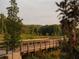 Wooden boardwalk path winds through lush greenery at 631 Silva St # 129, Cumming, GA 30040