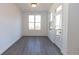 Light-filled dining room with hardwood floors and access to deck at 631 Silva St # 129, Cumming, GA 30040