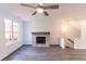 Bright living room with a fireplace and hardwood floors at 631 Silva St # 129, Cumming, GA 30040