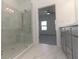 Large walk-in shower with marble tile and glass enclosure at 631 Silva St # 129, Cumming, GA 30040