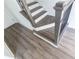 Modern staircase with dark wood railings and grey flooring at 631 Silva St # 129, Cumming, GA 30040