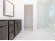 Bathroom featuring gray vanity with double sinks, tile floors, and walk-in glass shower at 362 Olmstead Way # 23, Alpharetta, GA 30002