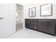 Bathroom featuring gray vanity with double sinks, tile floors, and an open doorway at 362 Olmstead Way # 23, Alpharetta, GA 30002