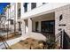 Inviting brick front porch with decorative columns, featuring modern exterior lighting and manicured landscaping at 362 Olmstead Way # 23, Alpharetta, GA 30002