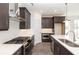 Modern kitchen featuring stainless steel appliances, a kitchen island, and dark wood cabinets at 362 Olmstead Way # 23, Alpharetta, GA 30002