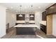 Modern open-concept kitchen with stainless steel appliances and a spacious kitchen island at 362 Olmstead Way # 23, Alpharetta, GA 30002