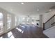 Bright living room featuring large windows, hardwood floors, and a fireplace at 362 Olmstead Way # 23, Alpharetta, GA 30002