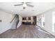 Expansive living area features a fireplace, staircase, and access to the kitchen at 362 Olmstead Way # 23, Alpharetta, GA 30002