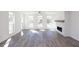 Living room filled with sunlight, features hardwood floors and a fireplace at 362 Olmstead Way # 23, Alpharetta, GA 30002