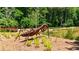 Outdoor space with a large insect sculpture surrounded by greenery and a small pond at 362 Olmstead Way # 23, Alpharetta, GA 30002
