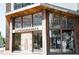 Exterior of Anthropologie store showing wooden beam architecture, glass windows, and rustic entrance at 362 Olmstead Way # 23, Alpharetta, GA 30002