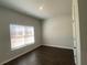 Spacious bedroom with large window and dark hardwood floors at 4555 Sweetlake Ct, Mableton, GA 30126