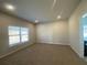 Spacious bonus room with neutral carpet and large window at 4555 Sweetlake Ct, Mableton, GA 30126