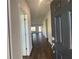 Bright entry hall with hardwood floors and views into the living room at 4555 Sweetlake Ct, Mableton, GA 30126