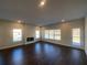 Large Gathering room with hardwood floors, fireplace, and access to patio at 4555 Sweetlake Ct, Mableton, GA 30126