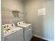 Laundry room with washer, dryer, and shelving at 4555 Sweetlake Ct, Mableton, GA 30126