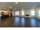 Open concept living area with hardwood floors, kitchen and fireplace at 4555 Sweetlake Ct, Mableton, GA 30126
