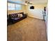 Finished basement with a leather couch and ceiling fan at 2641 Short Trl, Lithia Springs, GA 30122