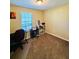 Bright bedroom with carpeted floor, window, and built-in shelving at 2641 Short Trl, Lithia Springs, GA 30122