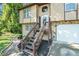 House exterior showcasing a wooden staircase and a garage at 2641 Short Trl, Lithia Springs, GA 30122