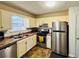 Kitchen with stainless steel appliances and light-colored cabinets at 2641 Short Trl, Lithia Springs, GA 30122