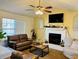 Cozy living room featuring a fireplace and comfortable seating at 2641 Short Trl, Lithia Springs, GA 30122