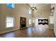 Open concept living room and kitchen with stone fireplace, high ceilings and lots of windows provide plenty of natural light at 932 Nestling Dr, Lawrenceville, GA 30045