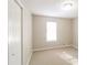 Well-lit bedroom with neutral carpeting and closet at 2920 Cushing Ct, Jonesboro, GA 30236