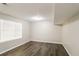 Bright bedroom with dark wood floors and window blinds at 2920 Cushing Ct, Jonesboro, GA 30236