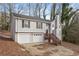 Two-story house with a two-car garage and a wooden deck, set on a sloping lot at 2920 Cushing Ct, Jonesboro, GA 30236
