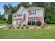 Charming two-story home with brick accents, well-manicured landscaping, and inviting curb appeal at 1215 Wandering Vine Ct, Mableton, GA 30126