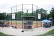 View of well-maintained baseball field with covered dugouts, seating, and lush trees in the background at 352 Olmstead Way # 28, Alpharetta, GA 30022