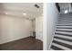 Finished basement featuring stylish dark floors, a kitchenette, and stairs at 352 Olmstead Way # 28, Alpharetta, GA 30022