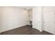 Finished basement with wet bar, featuring wood flooring and white doors at 352 Olmstead Way # 28, Alpharetta, GA 30022