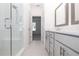 Sleek bathroom with glass-enclosed shower, double vanity, and tile flooring for a modern look at 352 Olmstead Way # 28, Alpharetta, GA 30022
