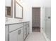 Modern bathroom featuring double vanity, glass shower, and walk in closet in neutral tones at 352 Olmstead Way # 28, Alpharetta, GA 30022