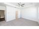 Bright, carpeted bedroom with open doorway and a ceiling fan, providing comfort and style at 352 Olmstead Way # 28, Alpharetta, GA 30022
