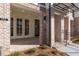Close-up of front porch showcasing brickwork and elegant architectural details at 352 Olmstead Way # 28, Alpharetta, GA 30022