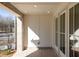 View of the front porch with brick flooring and white trim on the doorway at 352 Olmstead Way # 28, Alpharetta, GA 30022